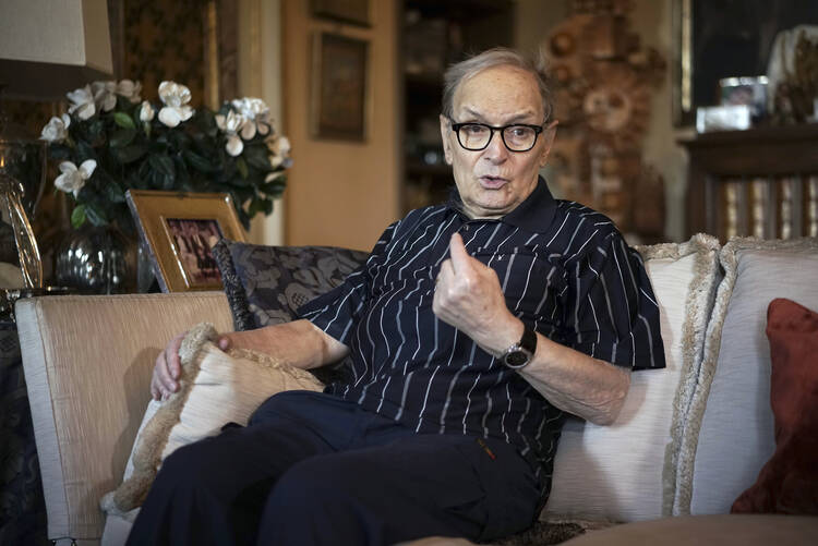 In this May 31, 2016 file photo, three-time best sound-track Oscar winner Ennio Morricone answers questions during an interview with The Associated Press, in Rome. Morricone died Monday, July 6, 2020 in a Rome hospital at the age of 91. (AP Photo/Andrew Medichini, file)