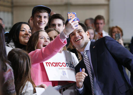 Republican presidential candidate, Sen. Marco Rubio, R-Fla., poses for a photograph at a campaign rally in Boise, Idaho, Sunday, March 6, 2016. (AP Photo/Paul Sancya)