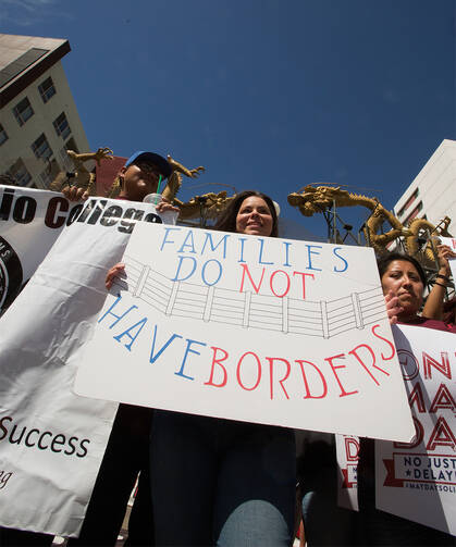 International Workers' Day supporters gather in downtown Los Angeles on May 1 to raise awareness about minimum wage and immigration issues (CNS photo/Victor Aleman, Vida-Nueva).