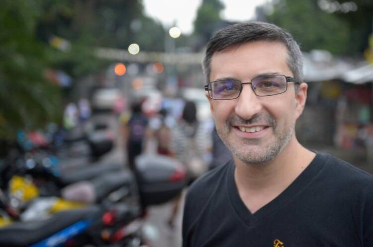 Father Luciano Feloni, an Argentine priest in Caloocan City, Philippines, poses for a photo Aug. 28. He is leading an effort to rehabilitate drug users rather than leave them vulnerable to a series of extrajudicial killings. (CNS photo/Paul Jeffrey)