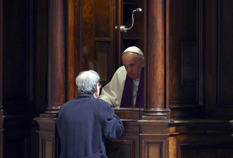 Pope Francis hears confession during a penitential liturgy in early March in St. Peter's Basilica (CNS photo/Alessandro Bianchi pool via EPA). 