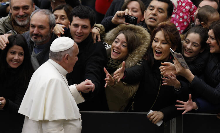 Pope Francis arrives to lead his general audience in Paul VI hall at the Vatican Jan. 7. (CNS photo/Paul Haring)