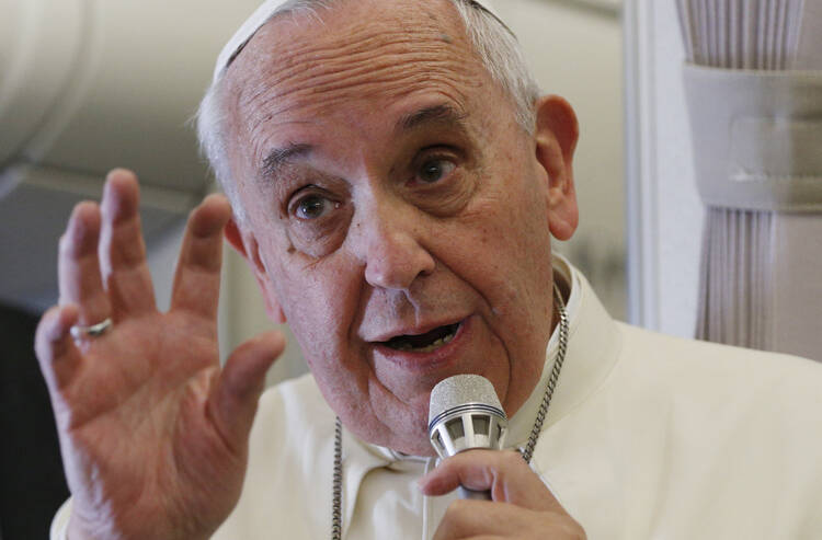 Let me rephrase that ... Pope Francis responds to questions about the September U.S. papal visit during a news conference aboard his flight from Manila, Philippines, to Rome Jan. 19. (CNS photo/Paul Haring) 