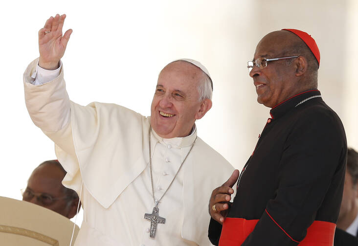 Pope waves to pilgrims from South Africa during general audience in St. Peter's Square, Sept. 25 (CNS Photo / Paul Haring).
