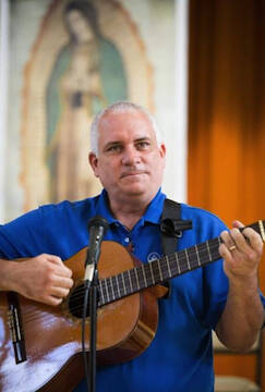 Deacon leads music during 2013 encuentro in St. Augustine, Fla. (CNS photo/Tom Tracy)