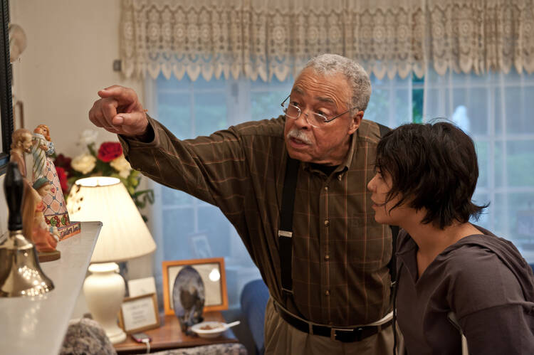 FATHER KNOWS BEST. James Earl Jones and Vanessa Hudgens in "Gimme Shelter."