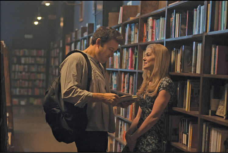 BEFORE THE FALL. Ben Affleck and Rosamund Pike in "Gone Girl."