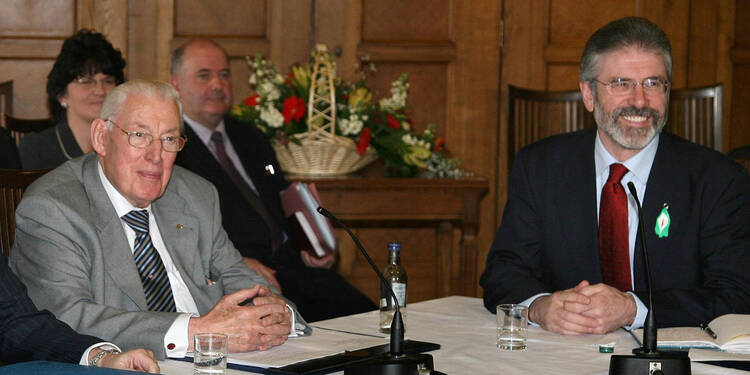 Democratic Unionist Party leader Ian Paisley, left, and Sinn Fein leader Gerry Adams, right, address a news conference after the main Protestant and Catholic parties agreed to start sharing power, May 8, 2007.