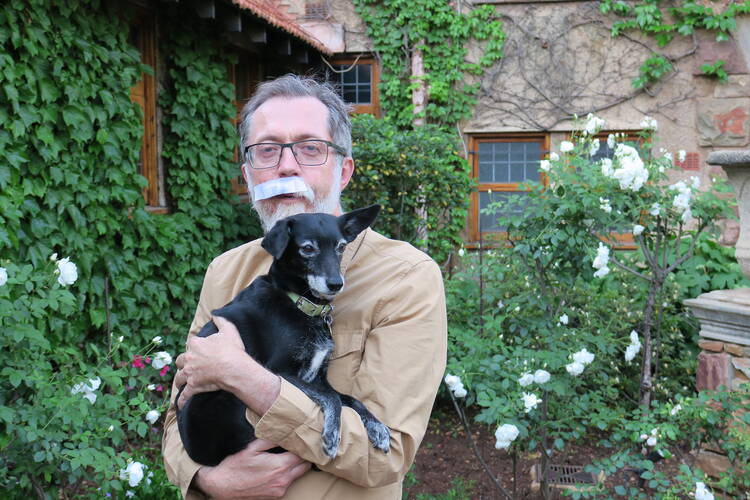 Father Pugin recovering at home with a friend