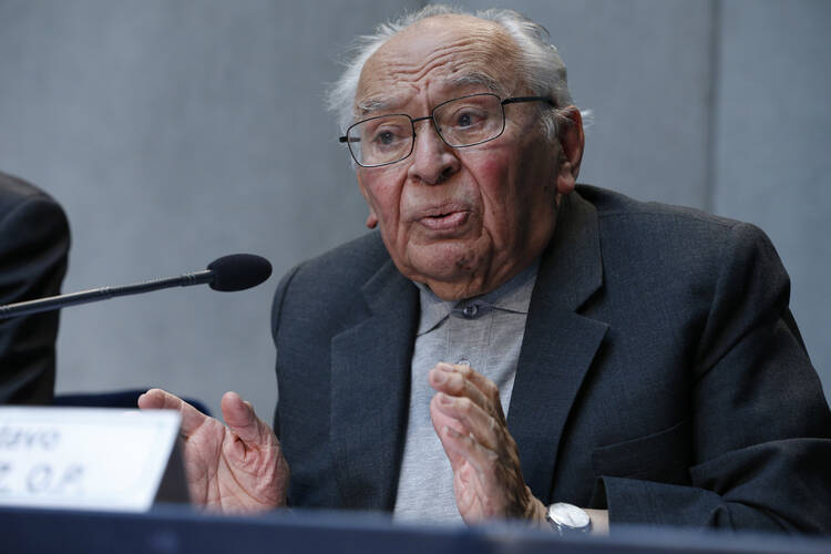 Dominican Father Gustavo Gutierrez speaks at Caritas Internationalis press conference at Vatican, May 12.