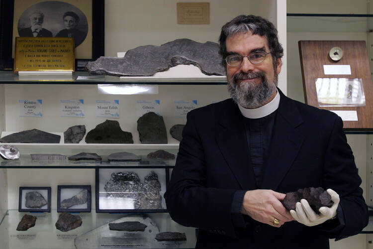 U.S. Jesuit Brother Guy Consolmagno, an astronomer with the Vatican Observatory, is pictured with the observatory's meteorite collection in this 2006 file photo.