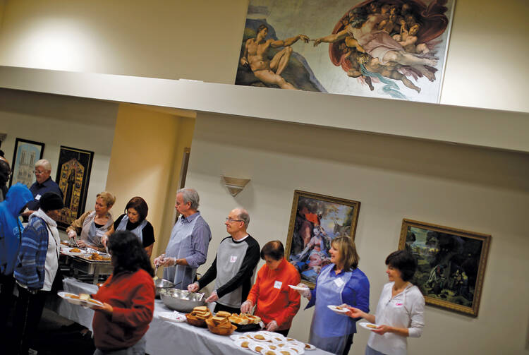 STEP RIGHT UP. Volunteers at the Emergency Assistance Program of Chicago Catholic Charities.