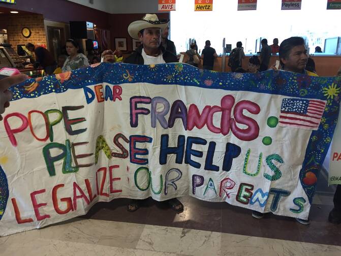 Pope Francis, Please Help. Migration and human rights activists greet reporters arriving in Juarez this afternoon. Photo: Kevin Clarke