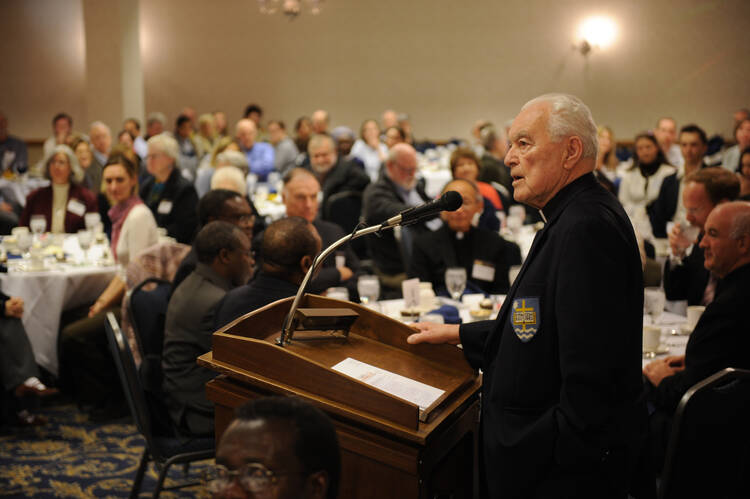 Hesburgh holds forth at a peace-building conference in 2008.