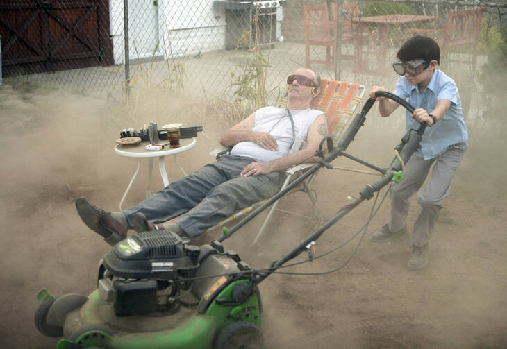Bill Murray and Jaeden Lieberher star in a scene from the movie "St. Vincent." The Catholic News Service classification is L -- limited adult audience, films whose problematic content many adults would find troubling. The Motion Picture Association of America rating is PG-13 -- parents strongly cautioned. Some material may be inappropriate for children under 13. (CNS photo/Atsushi Nishijima, The Weinstein Company)