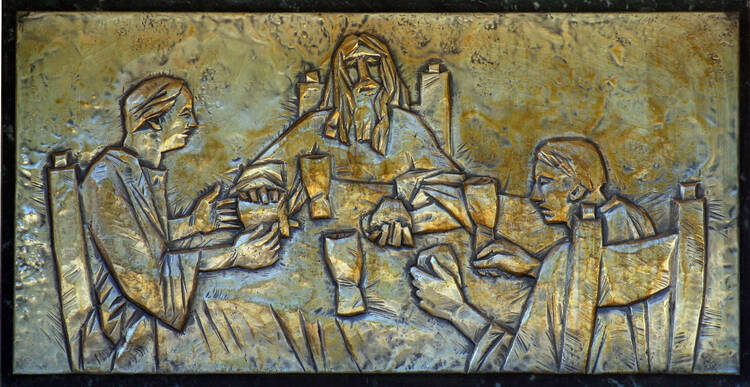 Supper at Emmaus. Jesus and two disciples sit around the table and share a meal.