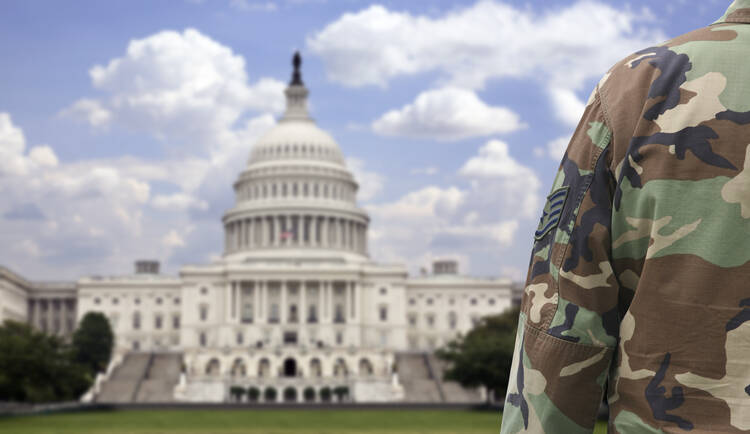 The most trusted institution in the United States, keeping watch in front of the least trusted institution. (iStock/inhauscreative)