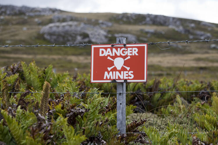 A warning sign marks one of the areas on the Falkland Islands not cleared of mines planted during the war with Great Britain  in 1982. (iStock/Gannet77)