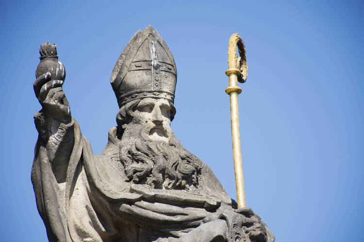 A St. Augustine statue at the Charles Bridge crossing the Vltava River in Prague, Czech Republic. (iStock/Tuayai)