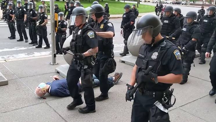 Martin Gugino bleeds on the sidewalk after being shoved by two Buffalo police officers Thursday, June 4, 2020, in Buffalo, New York. Video screengrab courtesy of WBFO