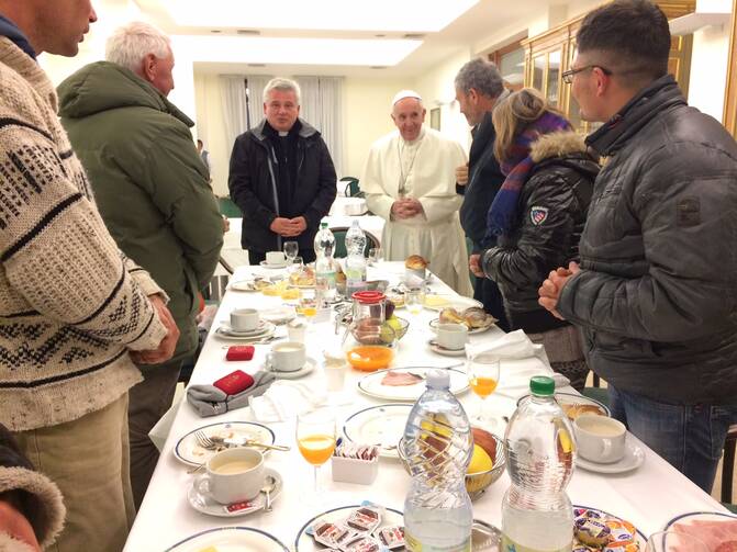 Pope saying grace with 8 homeless people on his 80th birthday. (L'Osservatore Romano)