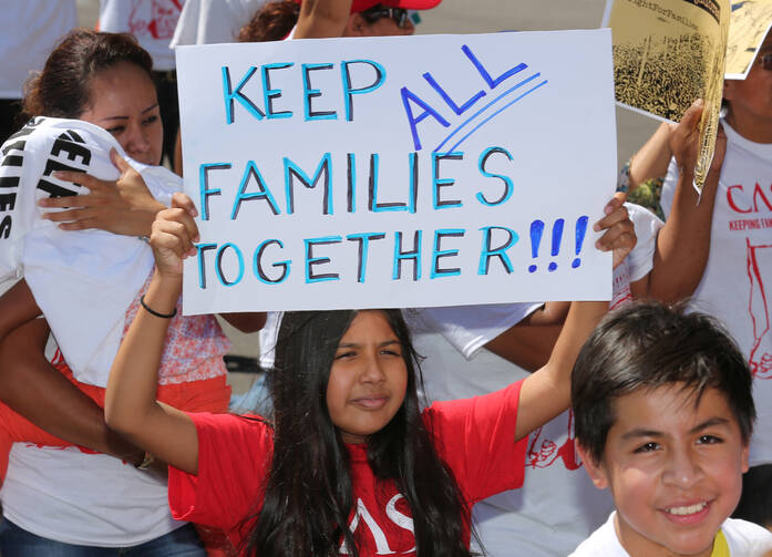 An immigration march and rally near the U.S. Immigration and Customs Enforcement headquarters in Washington last August. (CNS photo/Bob Roller) 