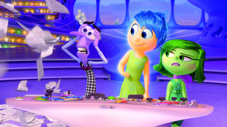 EMOTIONAL RESCUE. Animated characters Fear, Joy and Disgust in the movie "Inside Out" (CNS photo/courtesy Disney-Pixar).