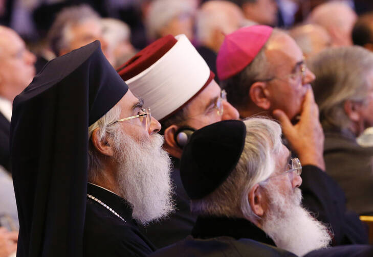 Guests of honor listen during the opening ceremony of the King Abdullah Bin Abdulaziz International Center in Vienna Nov. 2012