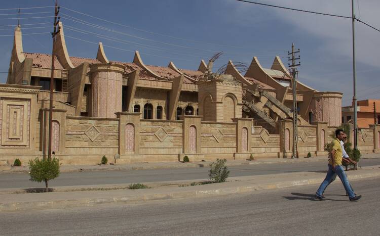 The badly damaged church of Mar Behnam and Mart Sarah awaits repairs in Baghdeda (Qaraqosh), Iraq. In the foreground is the church's collapsed bell tower, demolished by Daesh, as ISIS is known here, during its retreat from the city. Photo by Kevin Clarke.