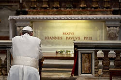 John Paul II in prayer. Courtesy of Catholic News Service.