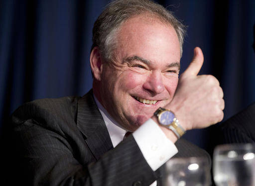 In this Feb. 4, 2016, file photo, Sen. Tim Kaine, D-Va., gives a 'thumbs-up' as he takes his seat at the head table for the National Prayer Breakfast in Washington. (AP Photo/Pablo Martinez Monsivais, File)