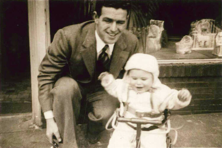 GROWING SEASON. The author and his father in front of his flower shop.