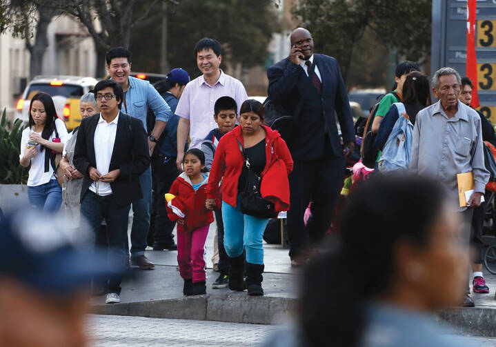PROMISES TO KEEP. People stand at an intersection in Koreatown, one of several neighborhoods designated by the Obama administration as a promise zone in Los Angeles, Calif., Jan. 22, 2014.