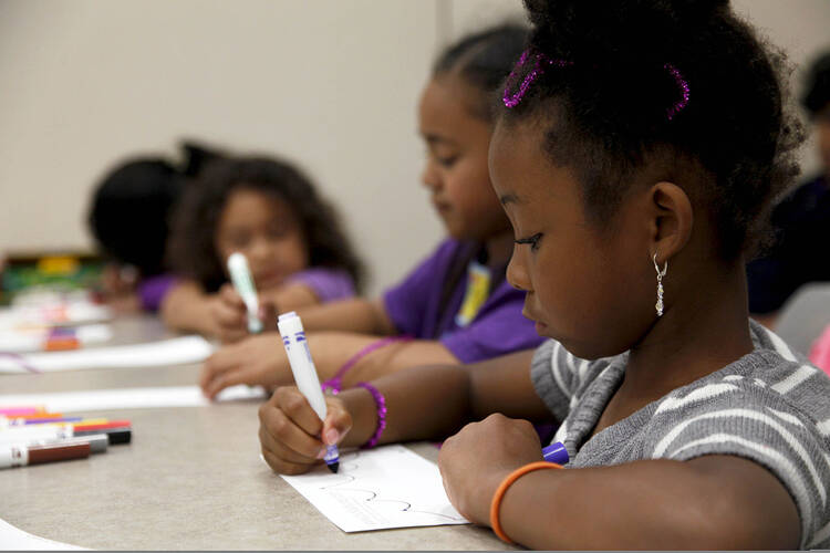 Children decorate a paper tiaras during the Military Child Education Coalition's, Tell Me a Story event, in the Warrior Hope and Care Center at Camp Pendleton Calif. By Cpl. Sarah Wolff, via Wikimedia Commons 