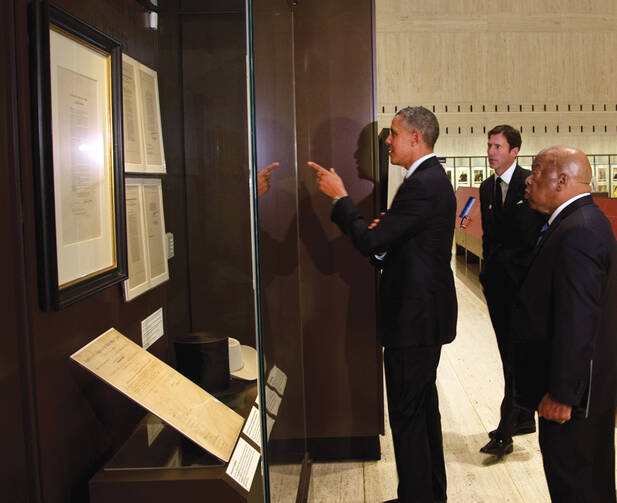 GOOD POINT. President Barack Obama and Representative John Lewis tour the Cornerstones of Civil Rights exhibit at the LBJ Presidential Library. 