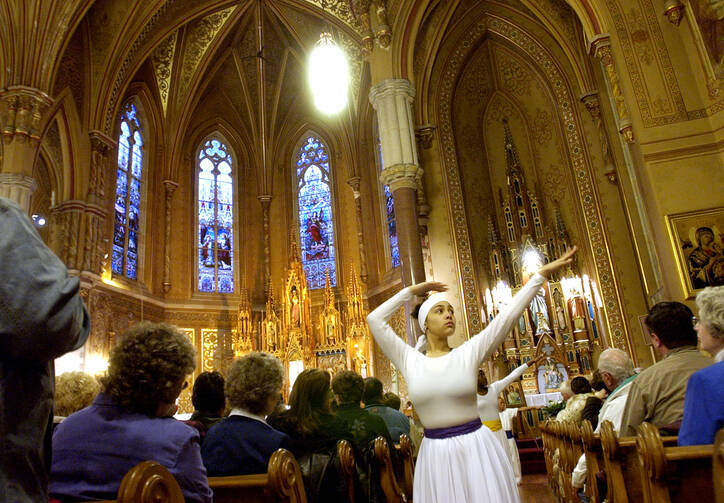 Liturgical dancers prepare the congregation for worship at St. Michael's Church in Rochester, N.Y., April 6, 2004.