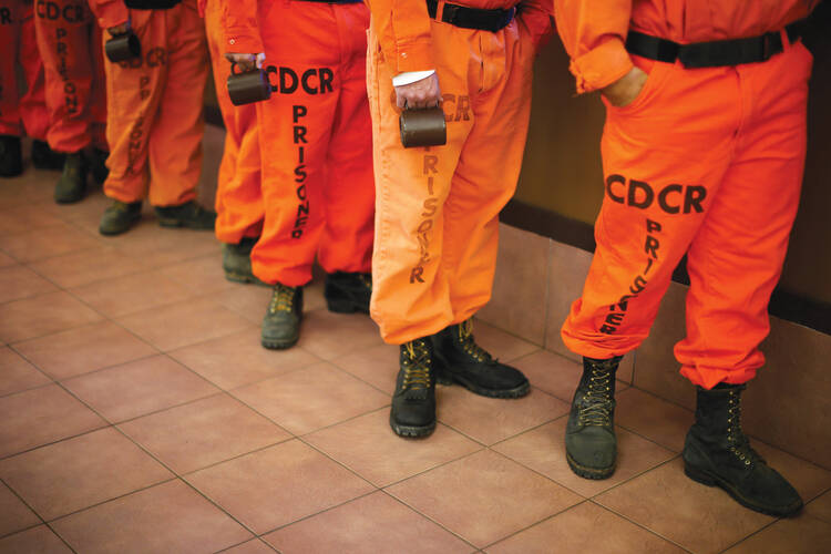 ￼ FIREBREAK. Prison inmates line up for breakfast at Oak Glen Conservation Fire Camp #35 in Yucalpa, Calif, in 2014.