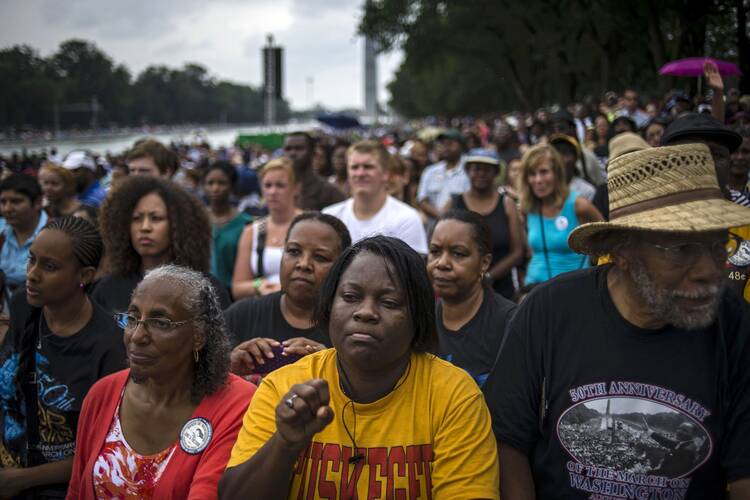 People gather around the reflecting pool of the Lincoln Memorial for the ceremony marking the 50th anniversary of the March on Washington Aug. 28. (CNS photo/James Lawler Duggan, Reuters)