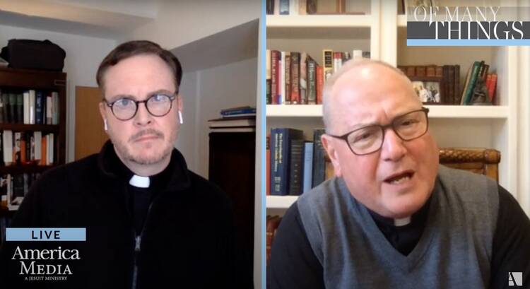 America Editor-in-Chief Matthew Malone, S.J., speaks with New York Cardinal Timothy Dolan on Facebook live on May 1. Screen capture by America Media.