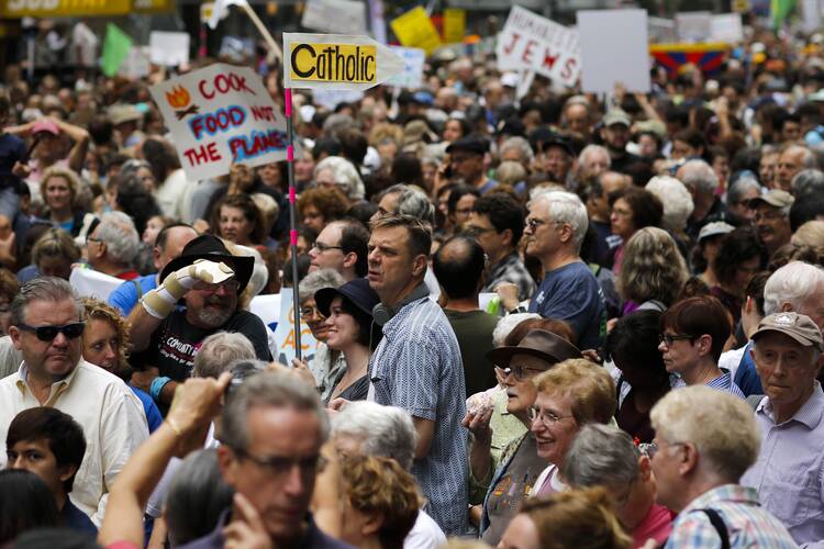 Catholics attend a rally to urge global action on climate change in New York Sept. 21. The United Nations will host a summit to discuss reducing carbon emissions that threaten the environment. (CNS photo/ Eduardo Munoz, Reuters)