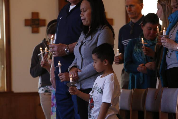 Families gather for Easter Mass at St. John by the Sea Church in Klawock on Prince of Wales Island in southeastern Alaska, April 19, 2014. (CNS photo/Nancy Wiechec) 