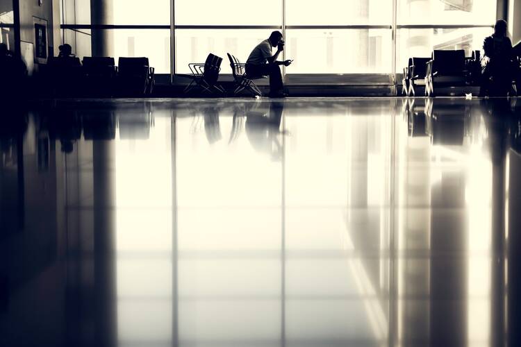 Man prays at airport