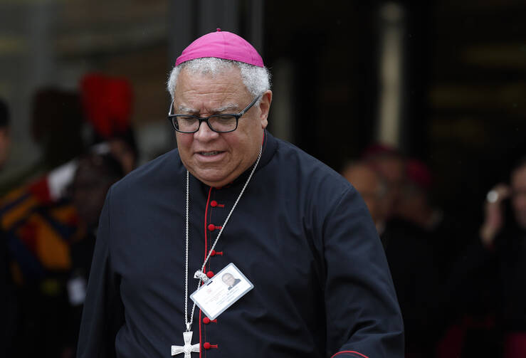 Bishop George V. Murry of Youngstown, Ohio, leaves a session of the Synod of Bishops on the family at the Vatican, Oct. 14 (CNS photo/Paul Haring).
