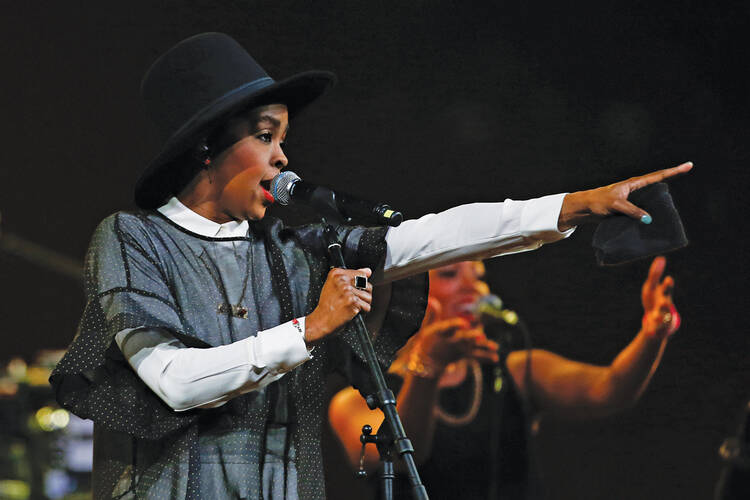 ON STAGE. Lauryn Hill performs during the Amnesty International Bringing Human Rights Home concert in New York, on Feb. 5, 2014.