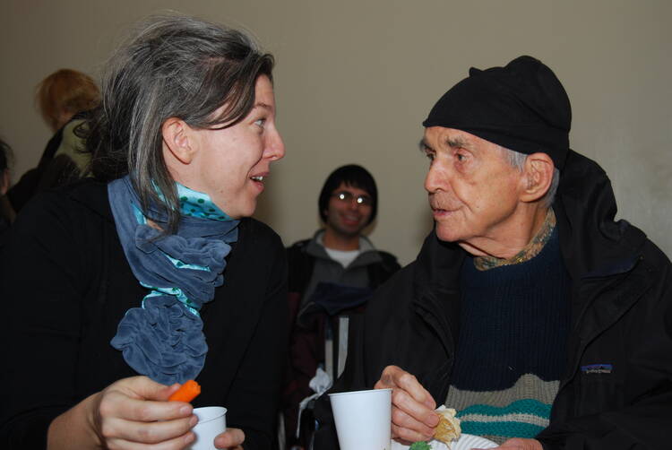 Berrigan and his niece, Frida Berrigan, at the Witness Against Torture event held in NYC's Lower East Side on December 18, 2008. Photo: Thomas Good/NLN