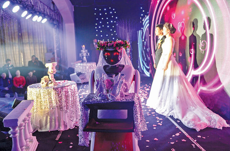 AT YOUR SERVICE. A robot, invented for restaurant service, serves as a bridesmaid at a wedding in Tianjin, Nov. 1, 2015.