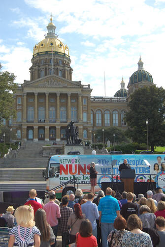 Father Michael Amadeo of Holy Trinity Parish in Des Moines, Iowa, speaks at an event launching the "Nuns on the Bus" and featuring U.S. Vice President Joe Biden, Sept. 18.