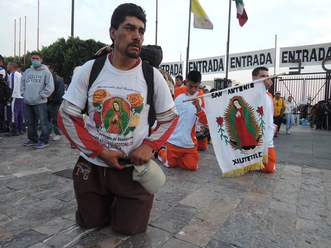 A man walks on his knees in honor of Our Lady of Guadalupe in Mexico City Dec. 10. Thousands of Mexican Catholics travel to Mexico City to attend celebrations for the Our Lady of Guadalupe feast day on Dec. 12. (CNS photo/David Agren)