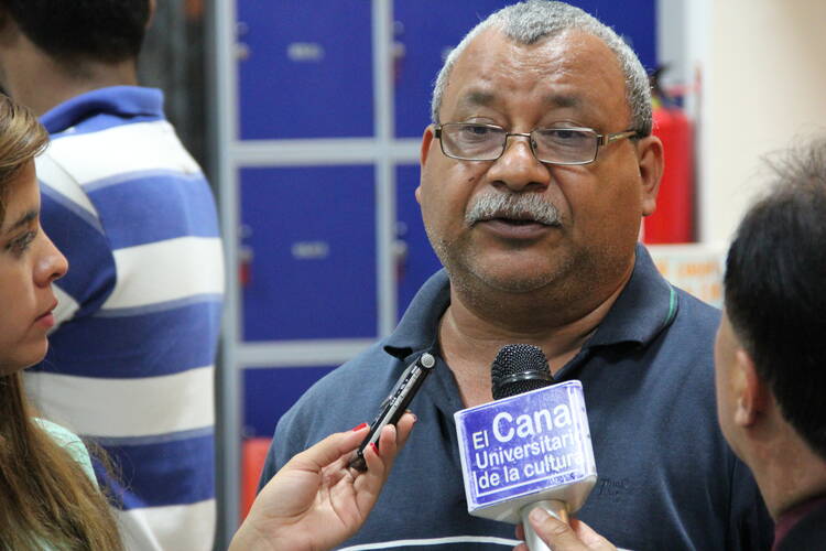 Padre Melo speaks to reporters at the National Autonomous University of Honduras in Tegucigalpa on Sept. 11, 2013. 