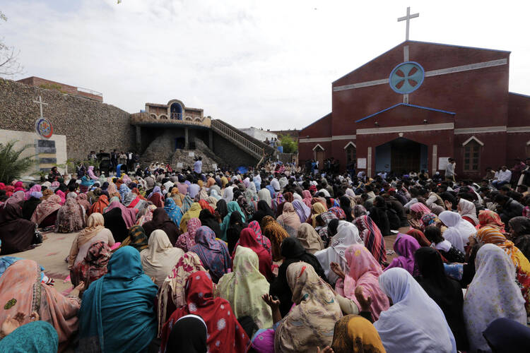 Pakistani Christians gather at a church March 16 to protest two suicide attacks on churches in Lahore. (CNS photo/Rahat Dar, EPA)